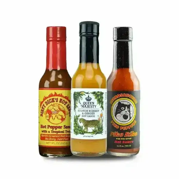 Three bottles of hot sauce with different labels